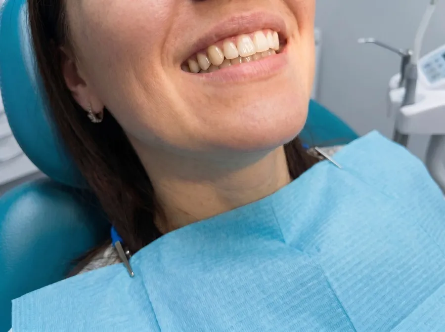 Patient after dental implant — natural-looking result
